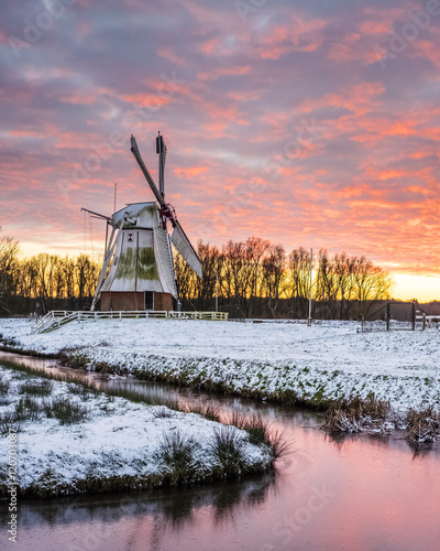 Witte Molen (White Mill) Dutch windmill in winter at sunset photo