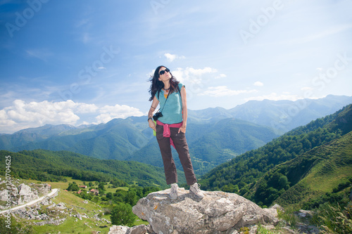 woman thinking on rock in Cantabrian mountain