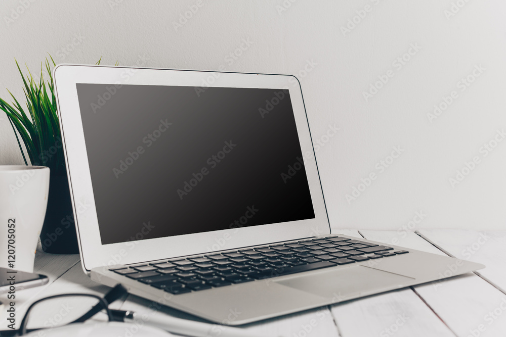Laptop and other electronics on workspace Laptop and other electronics on workspace