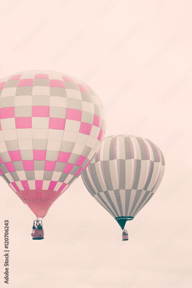Naklejka premium Two vintage hot air balloons in flight