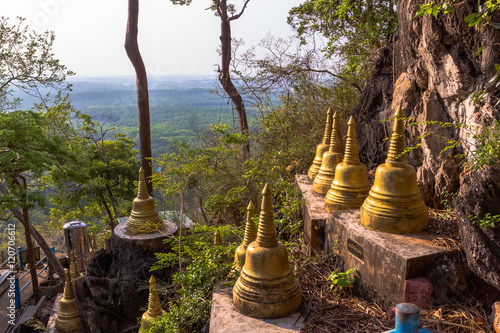 pagodas beside stair along the way to hilltop
of Wat Thumsuar or Tiger cave temple in Krabi province Thaiuland the highest temple in the south of Thailand photo