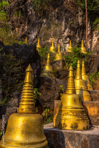 pagodas beside stair along the way to hilltop
of Wat Thumsuar or Tiger cave temple in Krabi province Thaiuland the highest temple in the south of Thailand photo