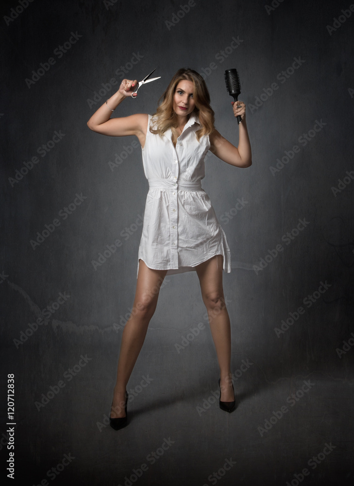 hair stylist with scissors and comb on hand hair stylist with scissors and comb on hand