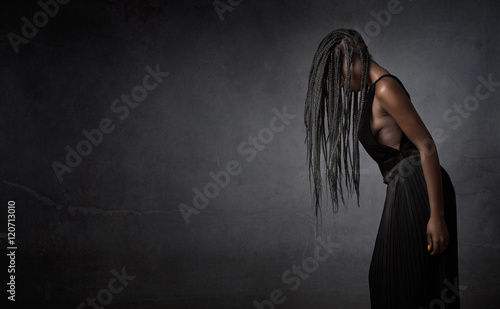 african girl hiding face with hair photo