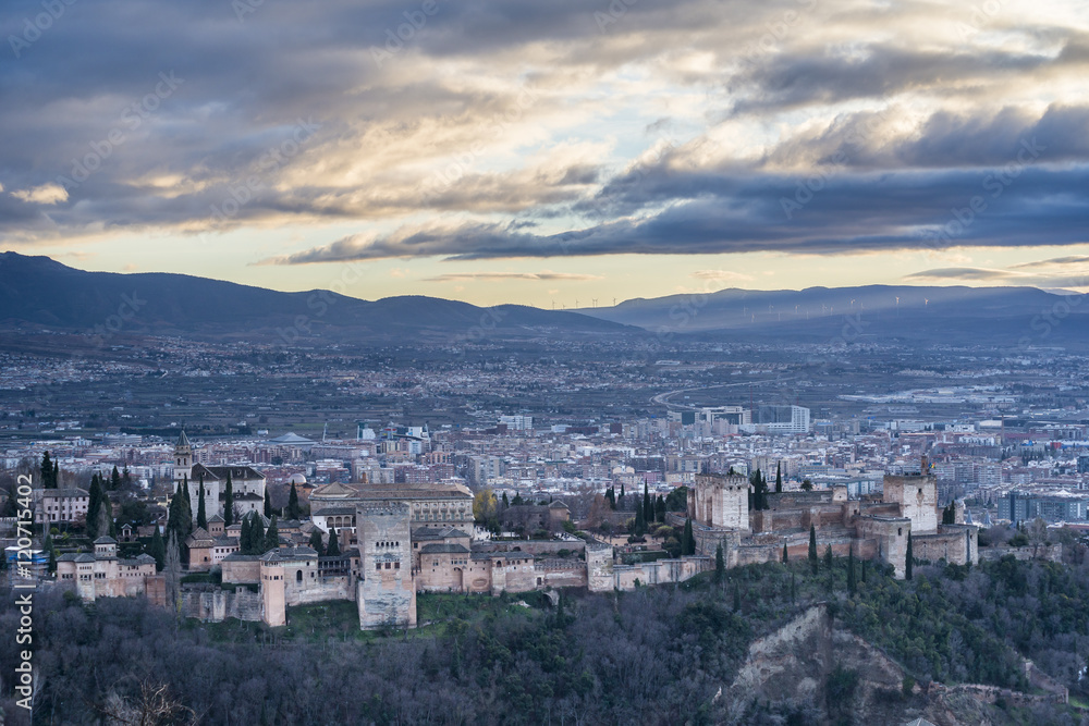 Panorama of Alhambra palace and fortress complex at dusk in Granada. Andalusia. Spain