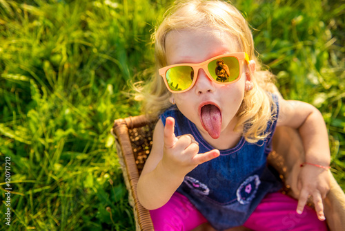 funny little girl in sunglasses