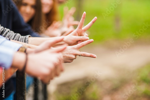 Hands of young people in the nature