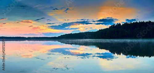 Fototapeta Naklejka Na Ścianę i Meble -  Beautiful panoramic view of the sunset over Lemiet lake in Mazury district, Poland. Fantastic travel destination.