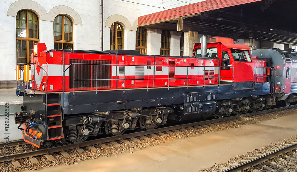 Passenger train on the station platform. Passenger train on the station platform.