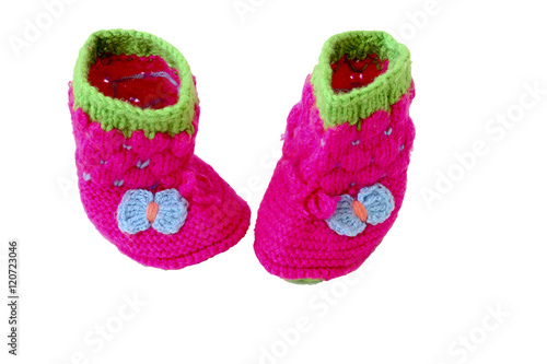 Baby booties shoes for newborn. Warm knitted shoes for babies isolated on a white background.The concept of heat.