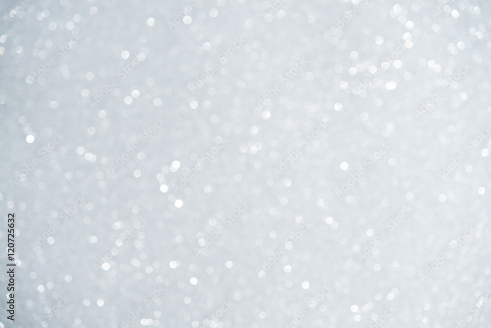 Unfocused abstract white glitter bokeh holiday background. Winter xmas holidays. Christmas. Unfocused abstract white glitter bokeh holiday background. Winter xmas holidays. Christmas.