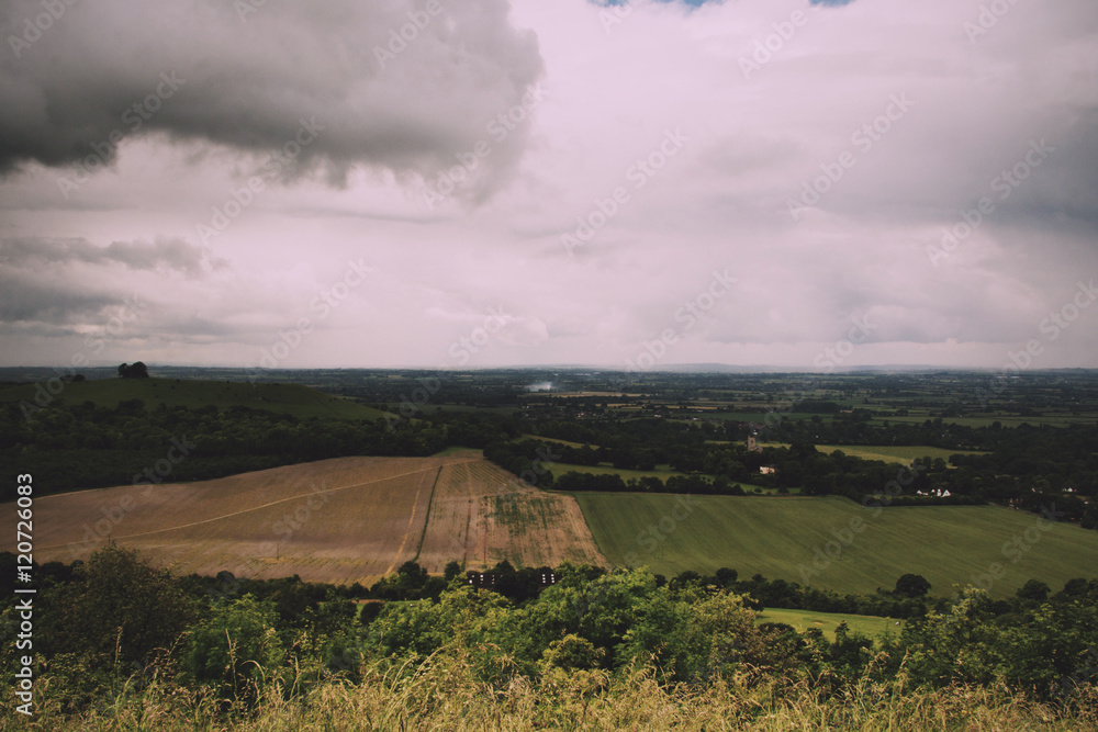Fototapeta premium Cloudy view over the Chilterns in Buckinghamshire Vintage Retro