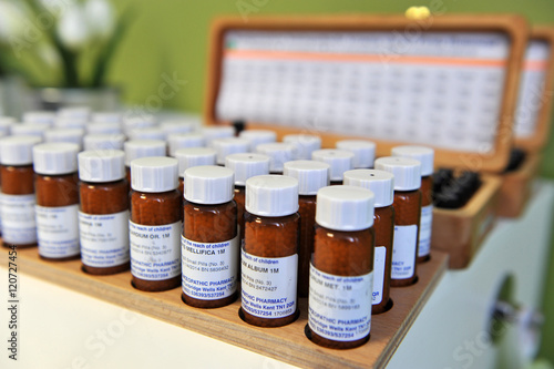 Homeopathic drugs on a shelve. photo