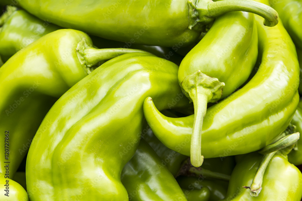 Hot green peppers for sale at a farmer's market Hot green peppers for sale at a farmer's market
