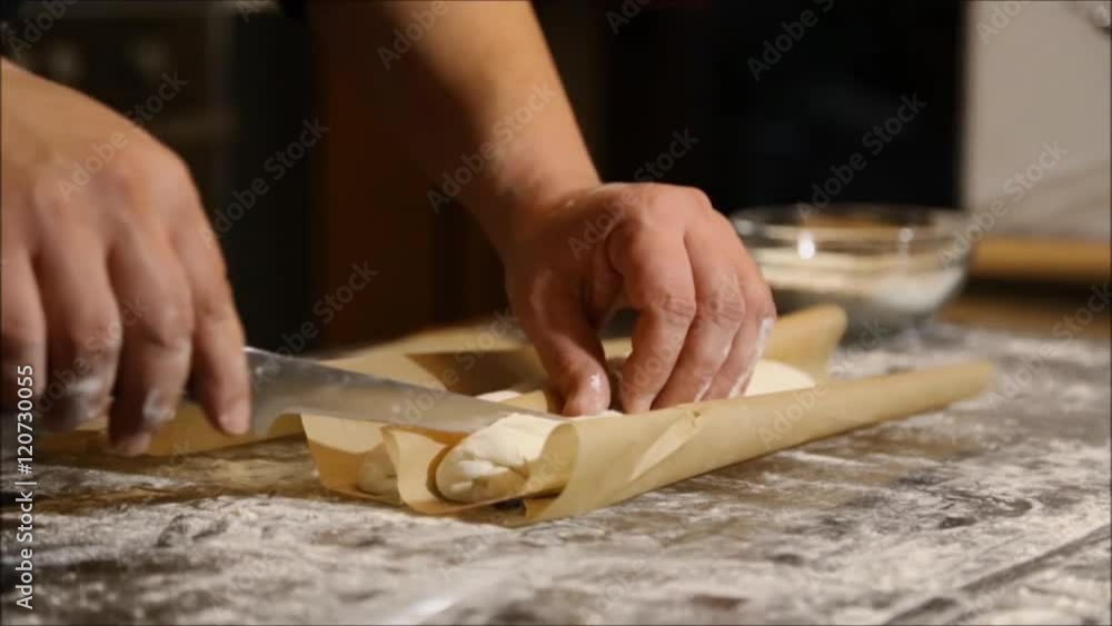 Making the final cuts for baguette bread Making the final cuts for baguette bread
