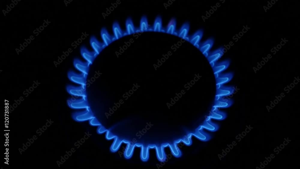 Natural gas stove burner blue flame. Close up Natural gas stove burner blue flame. Close up