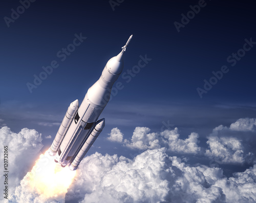 Fototapeta Naklejka Na Ścianę i Meble -  Space Launch System Takes Off In The Blue Sky