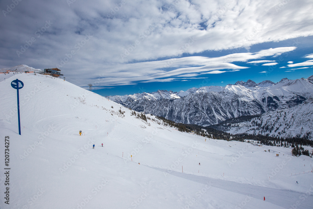 Obraz premium View to Ski slopes with the corduroy pattern and ski chairlifts on the top of Fellhorn Ski resort, Bavarian Alps, Oberstdorf, Germany
