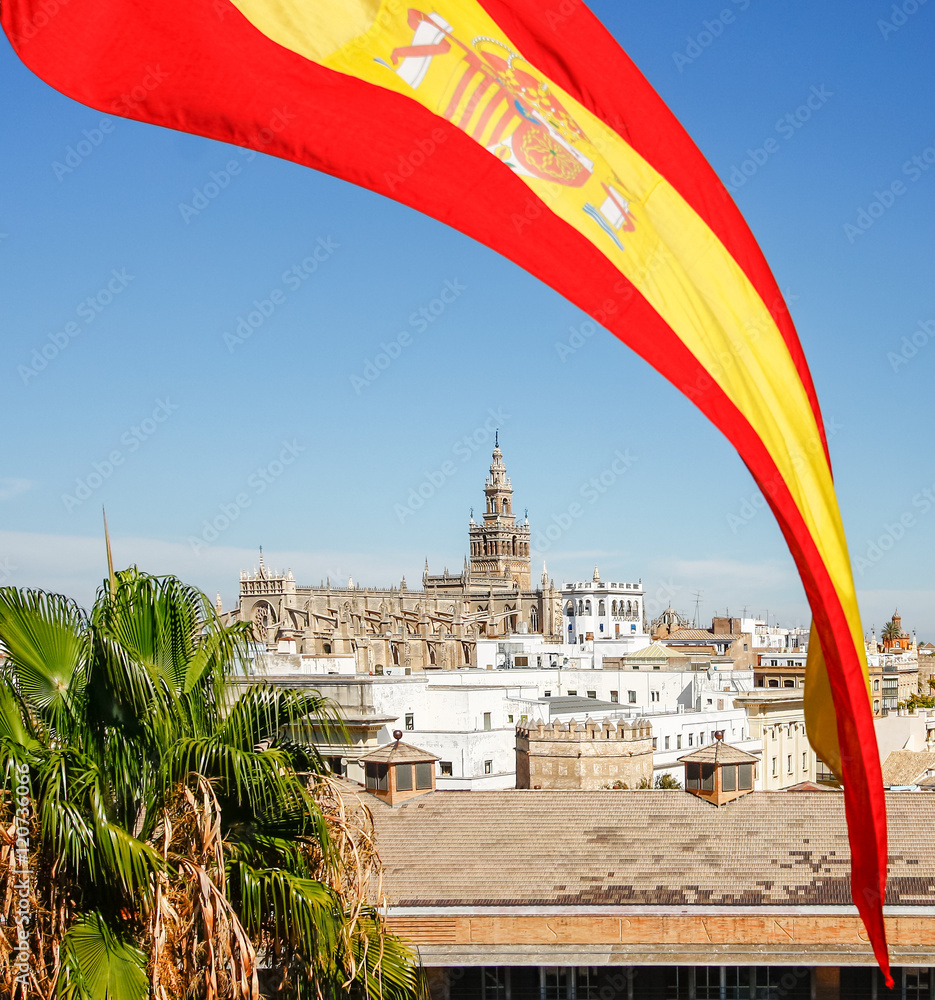 Spain flag over Cathedral of Saint Mary (Catedral de Santa Maria