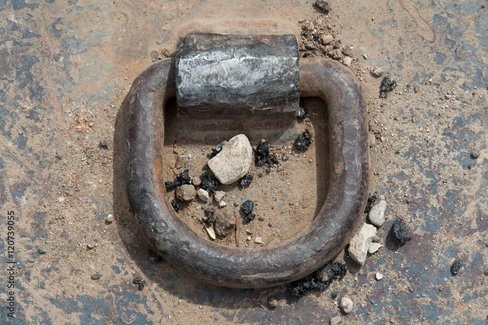 Close up of a hook on a construction cover Close up of a hook on a construction cover