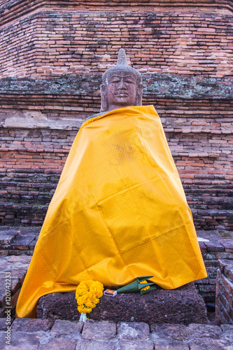 old Buddha statue with pagoda in wiang tha kan,Ancient City in c photo