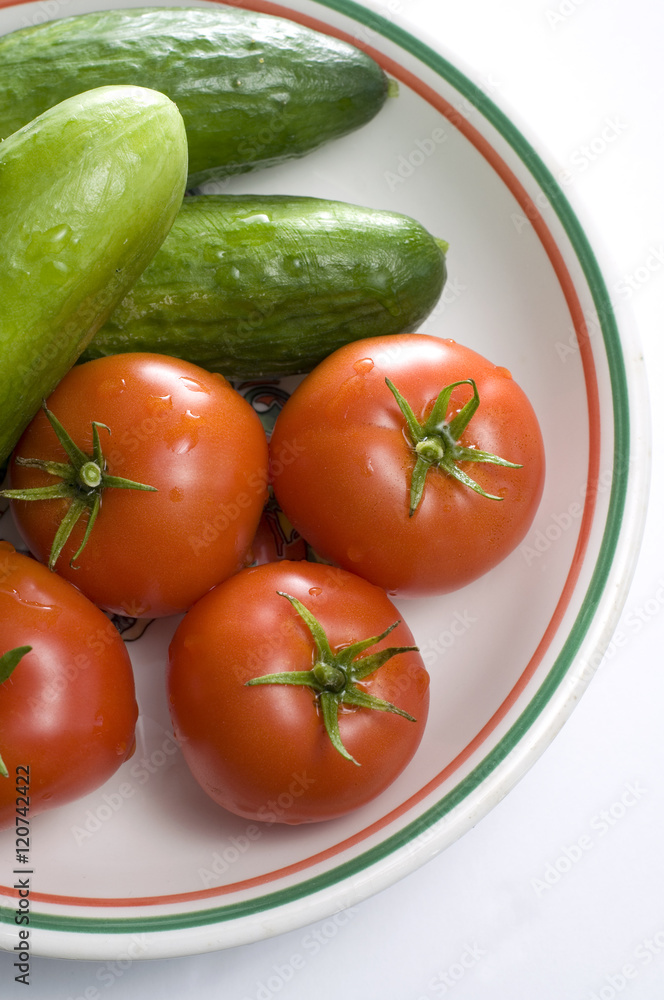 Fresh Red Tomatoes and Green Cucumbers Fresh Red Tomatoes and Green Cucumbers