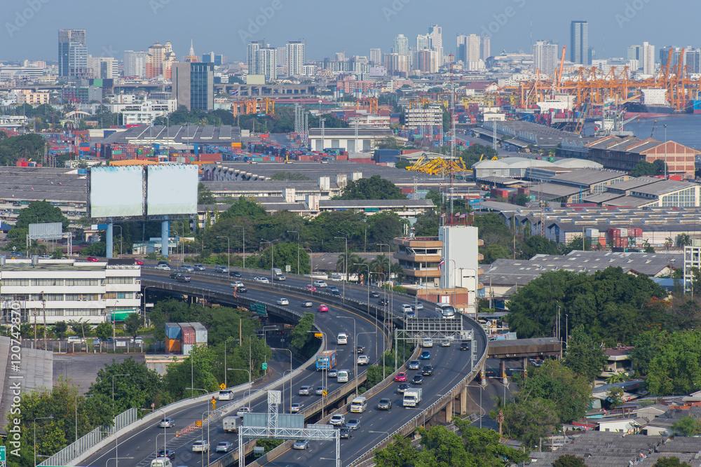 Bangkok skylines and highway traffic motion in the day time. The View from the top, Thailand. City scape and civilization concept.