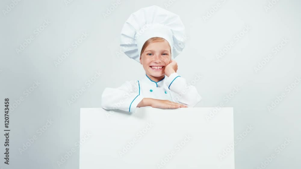 Portrait little chef cook with white board isolated on white smiling at camera. Thumb up. Ok Portrait little chef cook with white board isolated on white smiling at camera. Thumb up. Ok