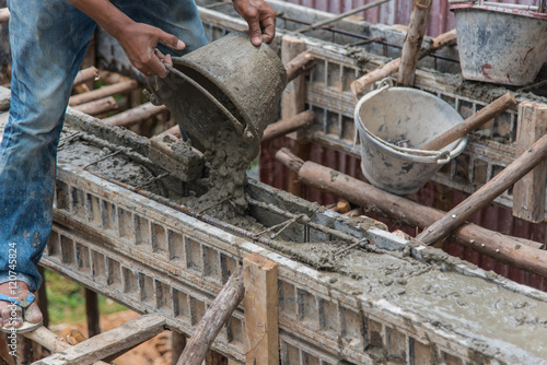 Concrete pouring during commercial concreting floors of buildings in construction(Commercial Building)