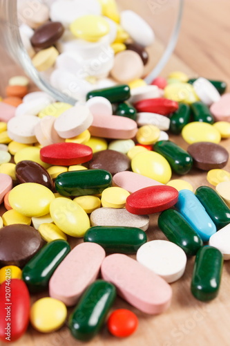 Heap of colorful medical pills and capsules, health care concept photo