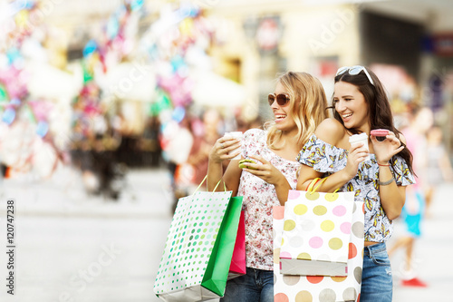 Beautiful young women enjoying shopping.