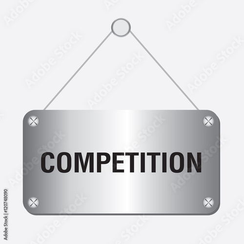 silver metallic competition sign hanging on the wall 