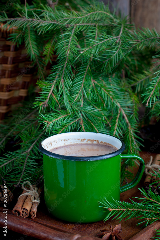 cup of green cocoa with cinnamon on wooden background. Christmas decorations cup of green cocoa with cinnamon on wooden background. Christmas decorations