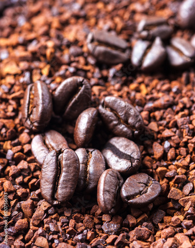Coffee bean on ground coffee background. © showcake