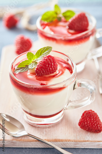 Panna cotta with rasperry and mint  topping with strawberry sauce