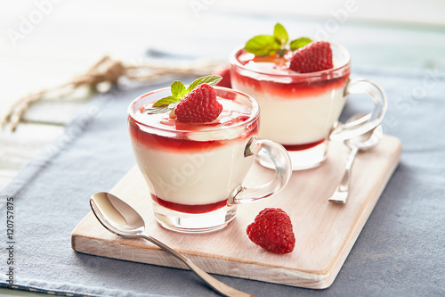 Panna cotta with rasperry and mint  topping with strawberry sauce photo