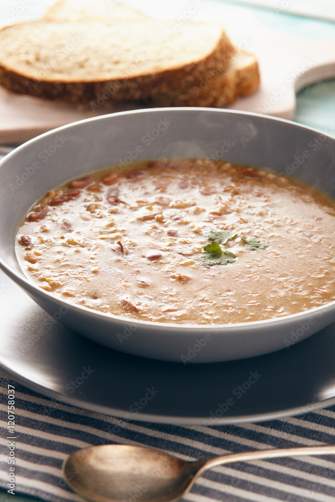 bean and spelt soup on a wooden table, bright colors bean and spelt soup on a wooden table, bright colors
