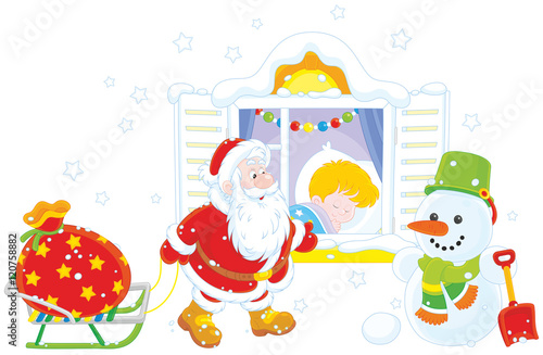 The night before Christmas, Santa Claus bringing his holiday presents for a little boy sleeping in his bedroom