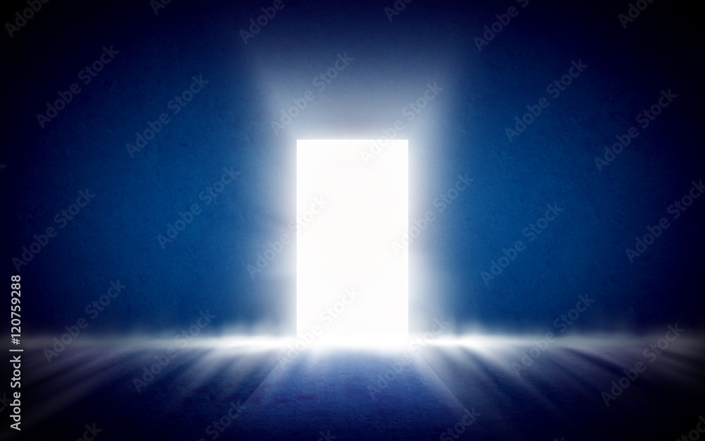 Glowing exit from dark room, open door