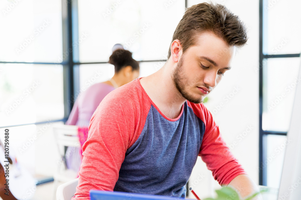 Young man working in office Young man working in office