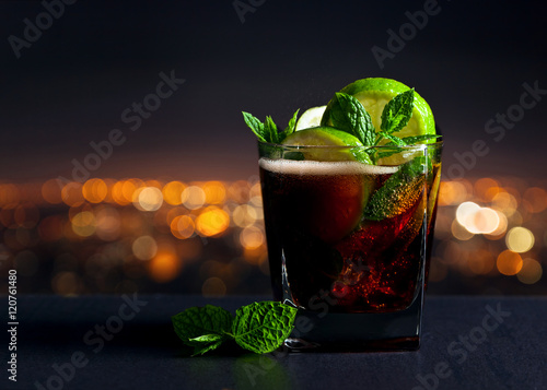 Cola with lime , ice  and peppermint photo