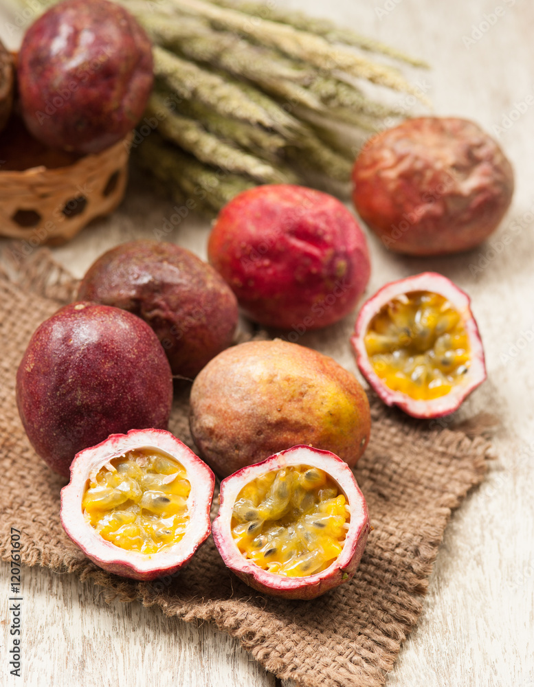 Passion fruits on wooden background