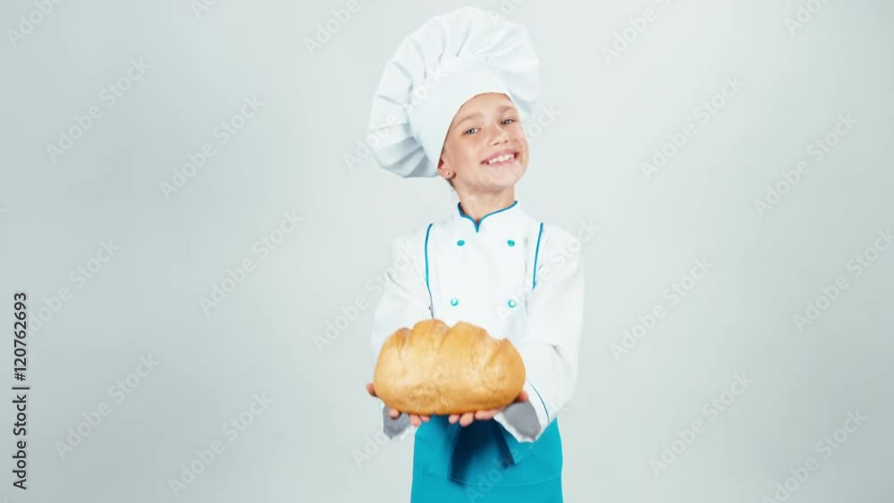 Portrait baker holds loaf of bread in her hands and gives you and smiling at camera isolated on white Portrait baker holds loaf of bread in her hands and gives you and smiling at camera isolated on white