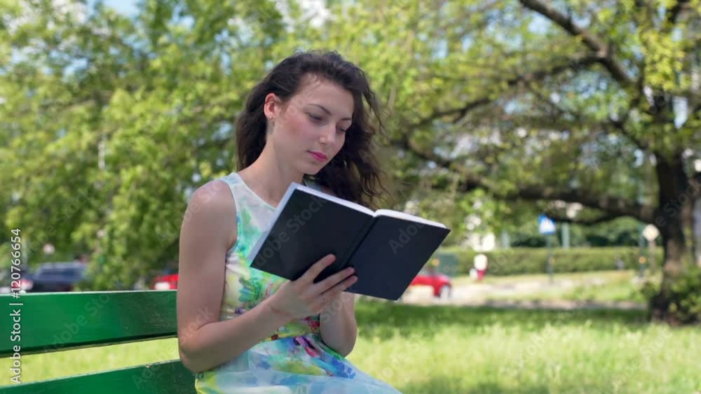 Pretty girl finish reading book in the park and relaxing on the bench
Pretty girl finish reading book in the park and relaxing on the bench