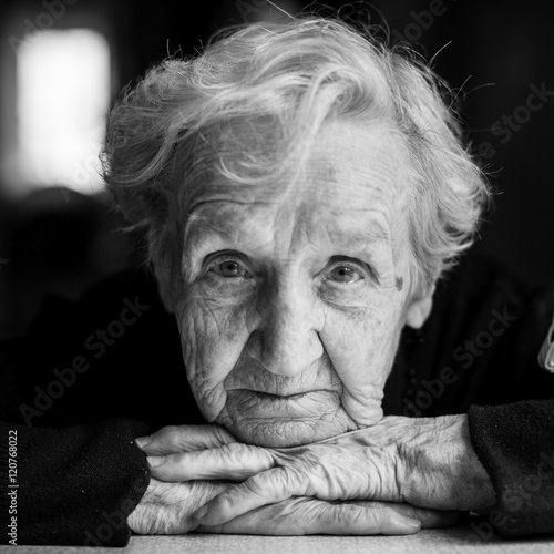 Elderly woman black and white portrait closeup.