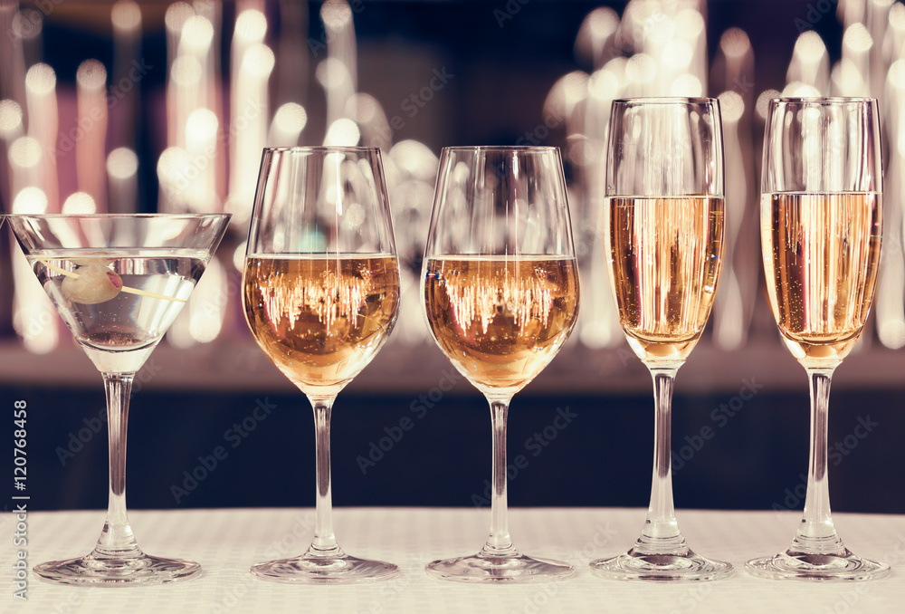 Assortment of alcoholic drinks in a party atmosphere. Assortment of alcoholic drinks in a party atmosphere.