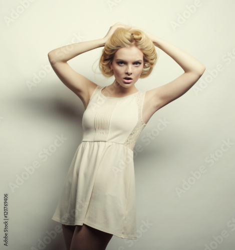 young magnificent woman in white dress.