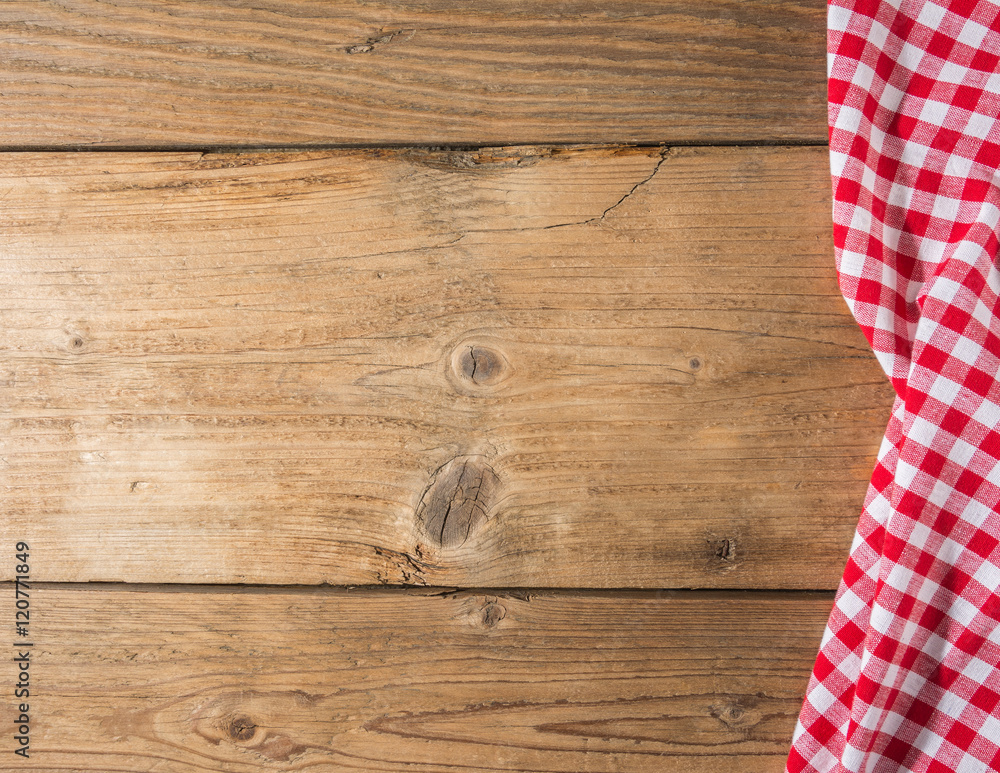 Checkered tablecloth red on the wooden background/ texture Checkered tablecloth red on the wooden background/ texture