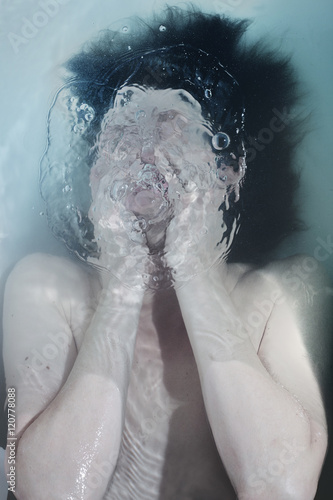 Portrait of a man drowning in the water