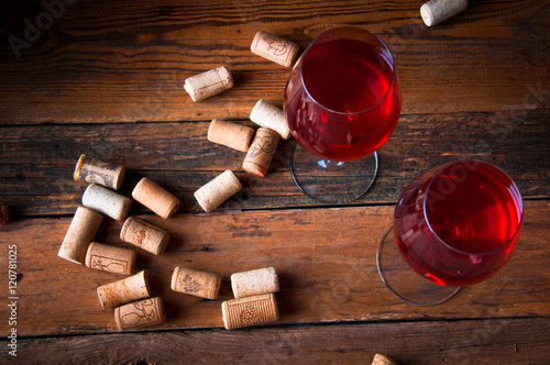 Wallpaper Mural Two glasses of red wine and corks. Copyspace. Top view Torontodigital.ca